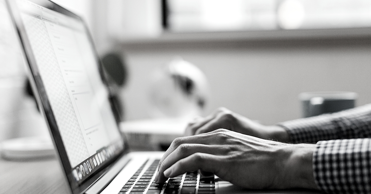 Furlough scheme: Man typing on Macbook