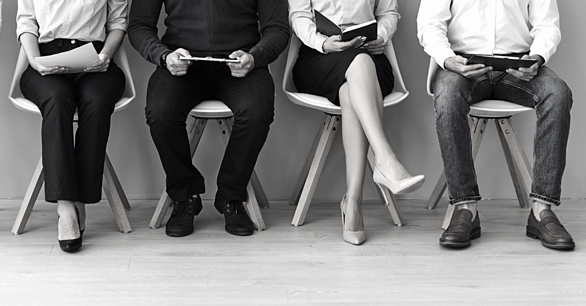 Candidates waiting in chairs to start recruitment process