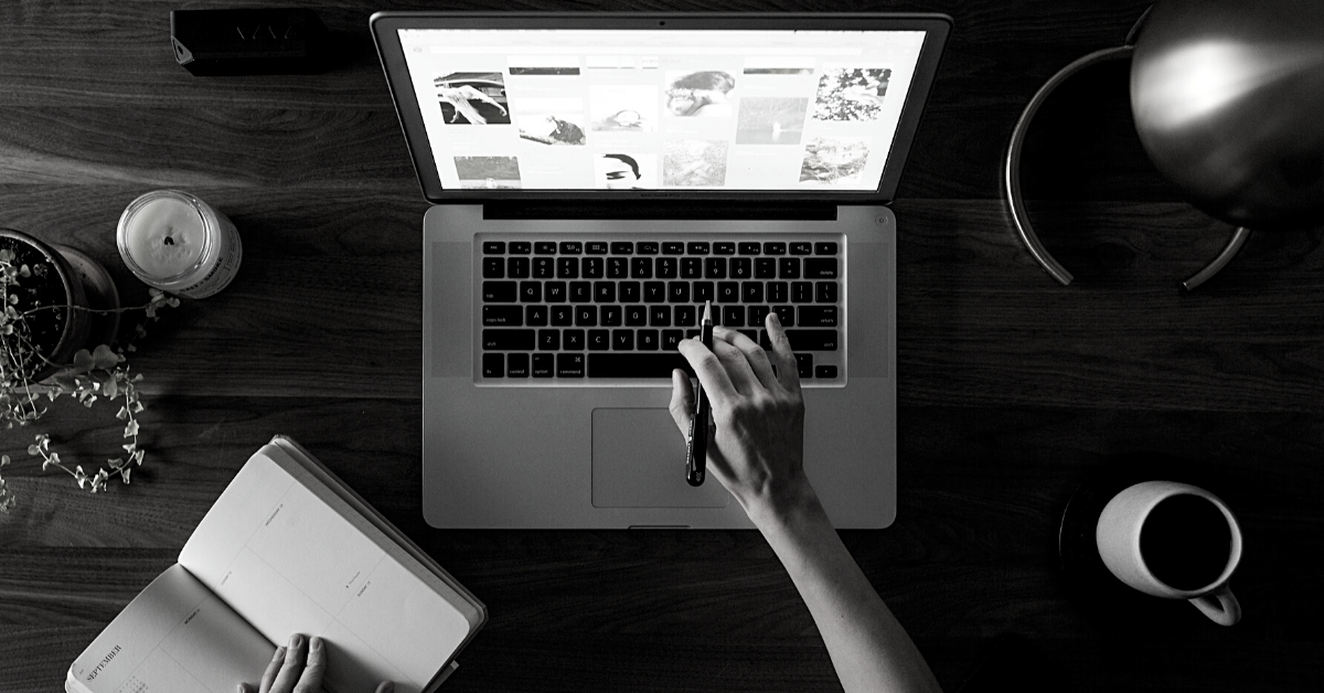 Woman researching companies on a laptop